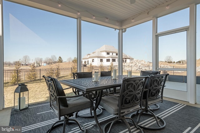 sunroom with track lighting