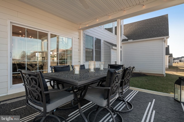 view of patio / terrace featuring outdoor dining space and fence