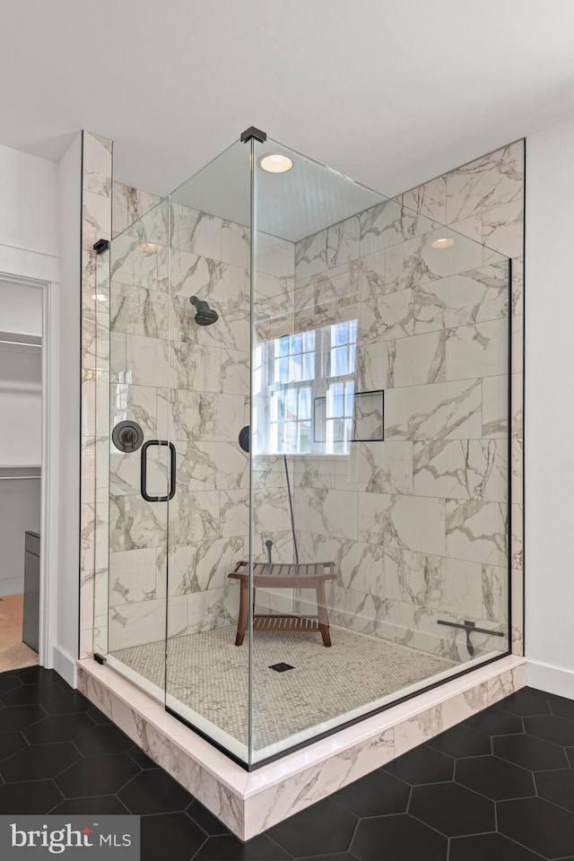 full bath with tile patterned floors and a stall shower