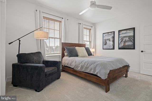 bedroom with carpet flooring, baseboards, and ceiling fan