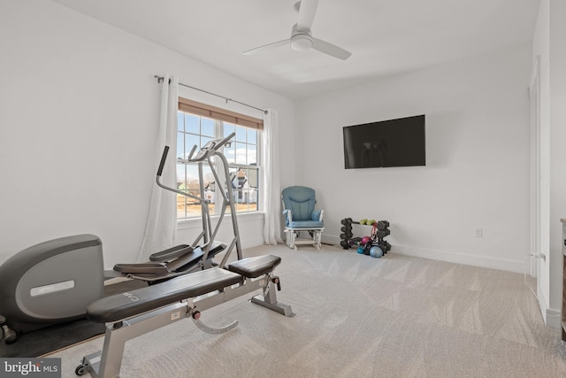 workout room with carpet flooring, a ceiling fan, and baseboards