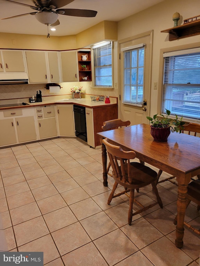 kitchen with white cabinetry, dishwasher, backsplash, and light tile patterned floors