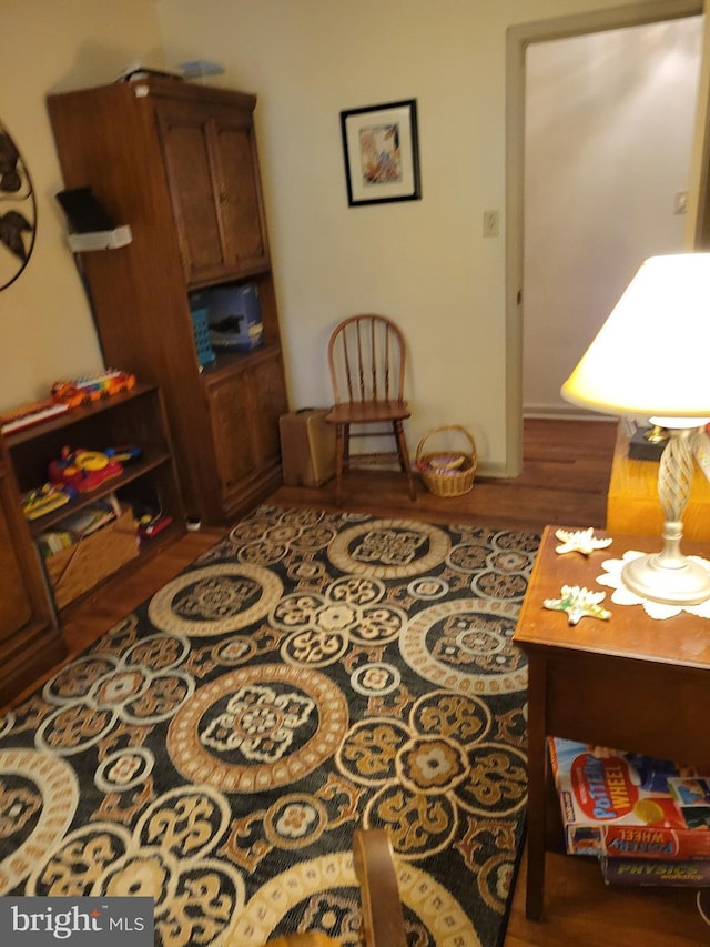 sitting room featuring wood finished floors