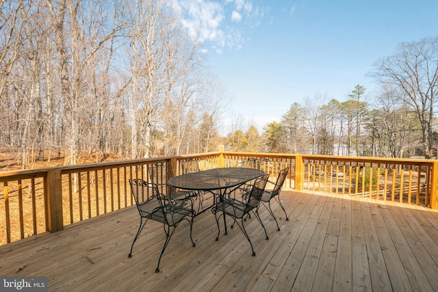 wooden deck featuring outdoor dining space