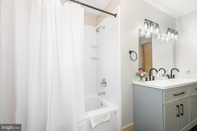 bathroom featuring shower / tub combo and vanity