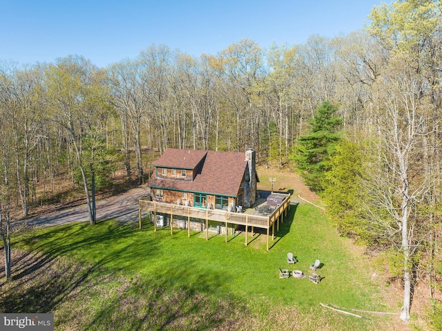 aerial view with a wooded view