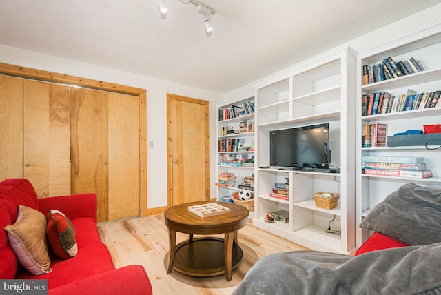 living area with wood finished floors