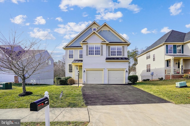 view of front of property featuring driveway, a garage, fence, and a front lawn