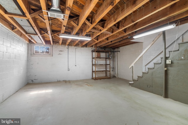 basement featuring stairs