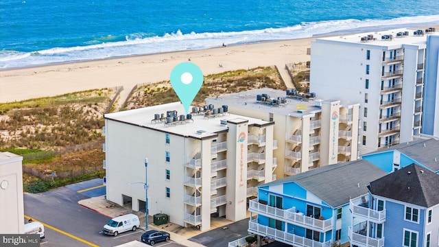 aerial view featuring a water view and a beach view