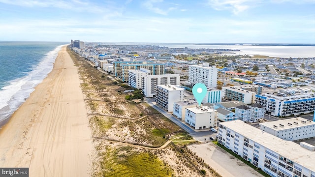 birds eye view of property featuring a city view, a beach view, and a water view