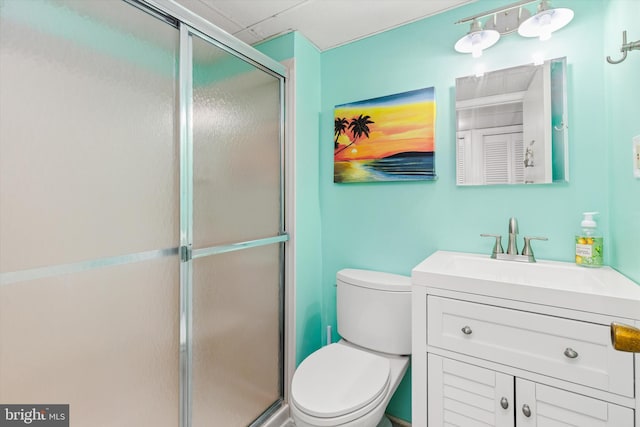 full bathroom with a shower stall, toilet, and vanity