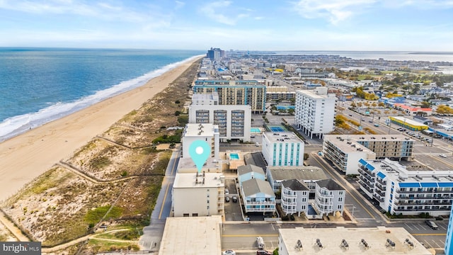 bird's eye view with a water view and a view of the beach