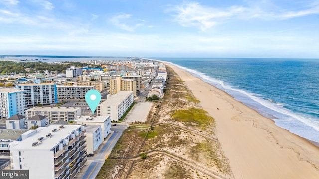 aerial view featuring a water view, a view of city, and a view of the beach