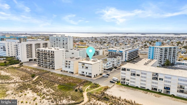 drone / aerial view with a view of city and a water view