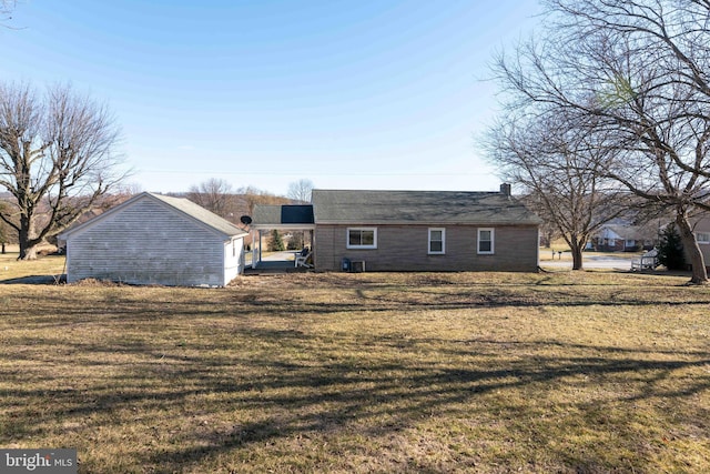 back of property featuring a yard