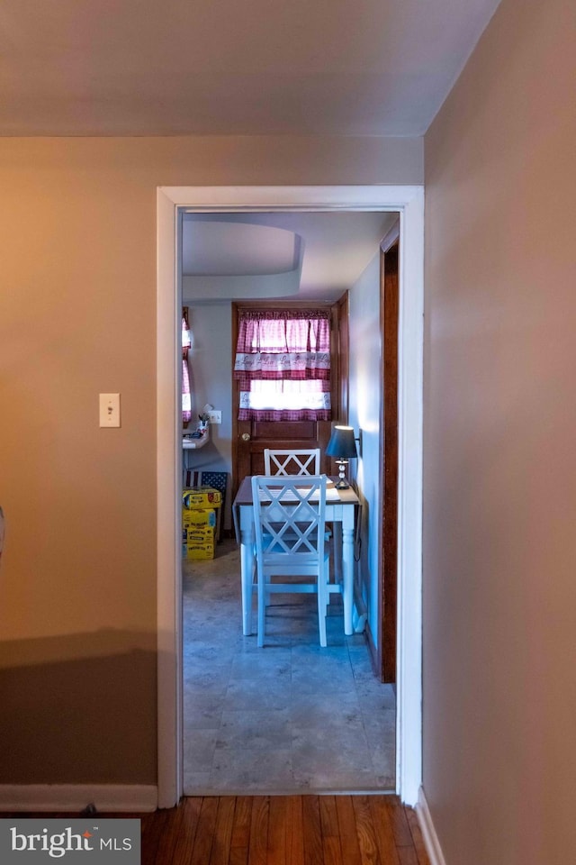 hall featuring wood finished floors