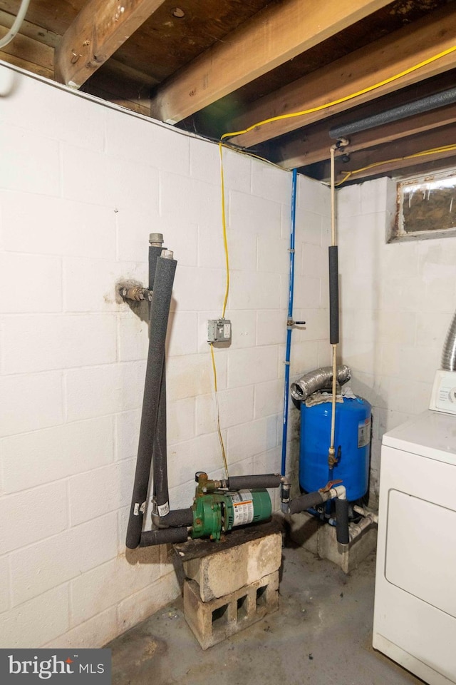 unfinished basement with washer / dryer