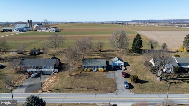 birds eye view of property with a rural view