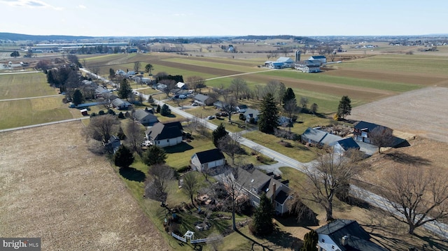 birds eye view of property with a rural view