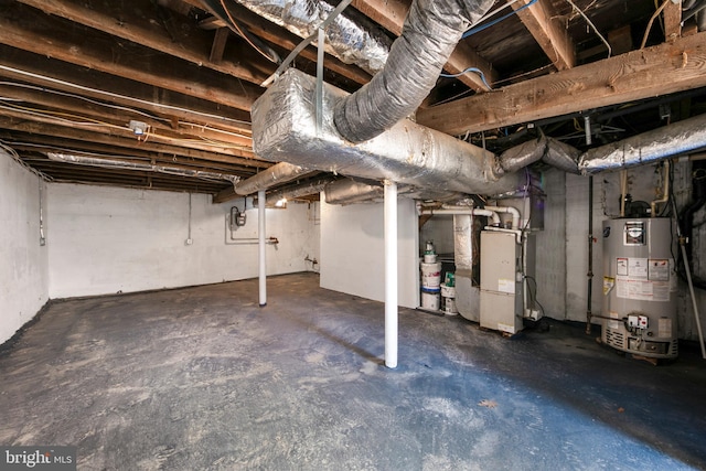 unfinished below grade area with gas water heater and heating unit