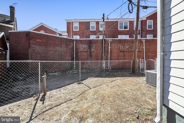 view of yard featuring fence and cooling unit