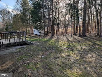 view of yard with a wooden deck