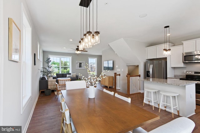 dining room with ceiling fan, baseboards, dark wood-type flooring, and recessed lighting