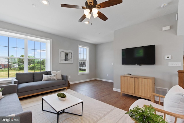 living room with recessed lighting, visible vents, ceiling fan, wood finished floors, and baseboards