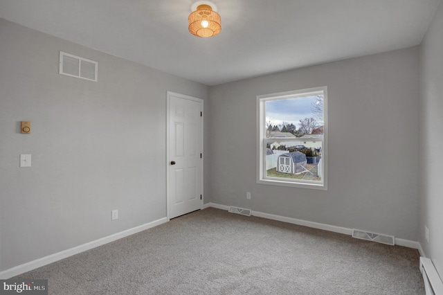 unfurnished room featuring carpet, a baseboard radiator, and visible vents