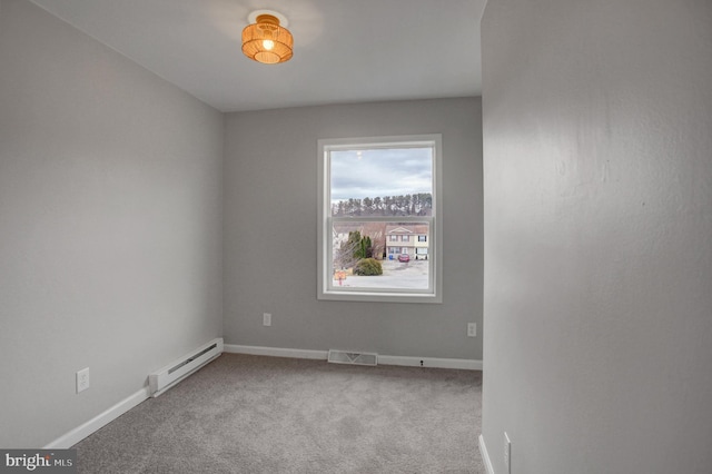 unfurnished room featuring carpet flooring, visible vents, baseboards, and baseboard heating