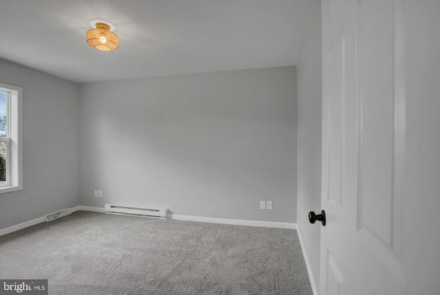 unfurnished room with a baseboard radiator, carpet flooring, visible vents, and baseboards