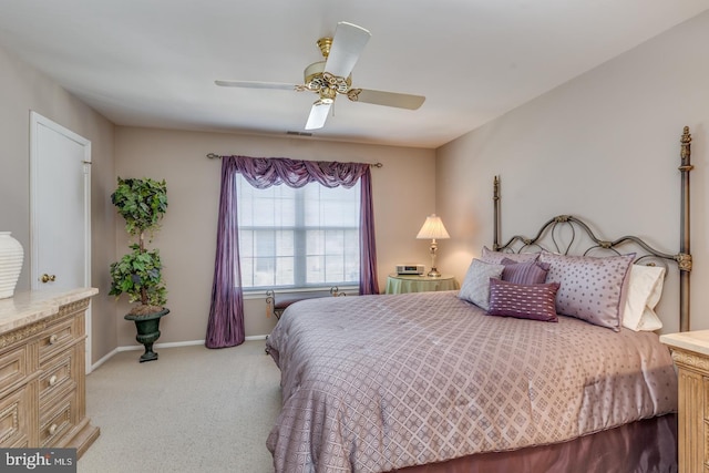 bedroom featuring a ceiling fan, baseboards, and carpet flooring