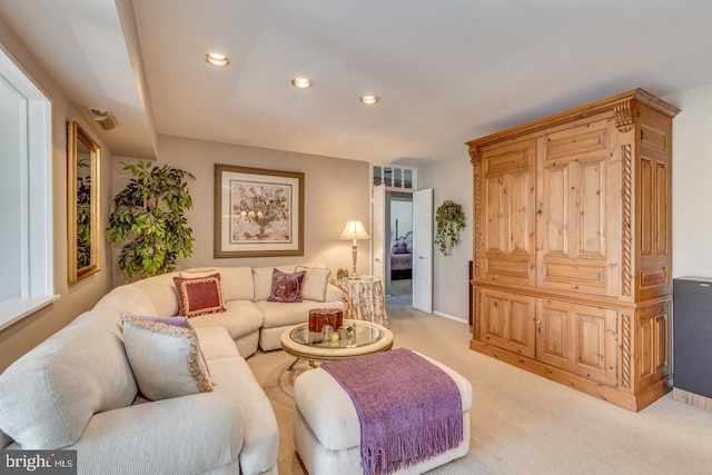 living area with baseboards, recessed lighting, and light colored carpet