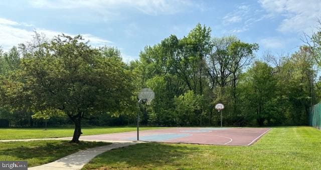 view of sport court with community basketball court and a lawn