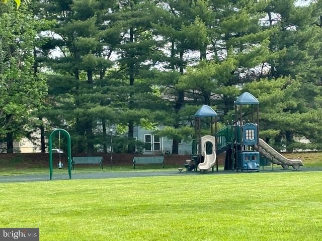 communal playground featuring a yard