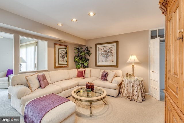 living area featuring carpet and recessed lighting