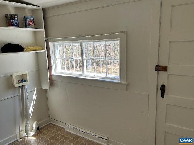 washroom featuring washer hookup, laundry area, and baseboards