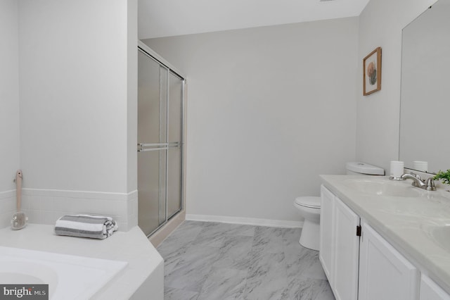 bathroom featuring toilet, marble finish floor, a shower stall, and vanity