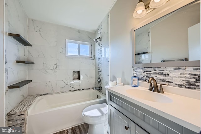 bathroom with vanity, bathing tub / shower combination, backsplash, and toilet