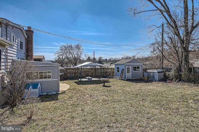 view of yard featuring a fenced backyard and an outdoor structure