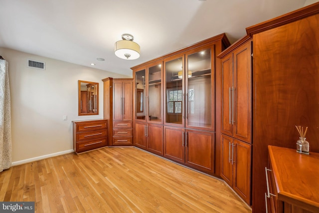 unfurnished bedroom featuring light wood-style flooring, recessed lighting, baseboards, and visible vents