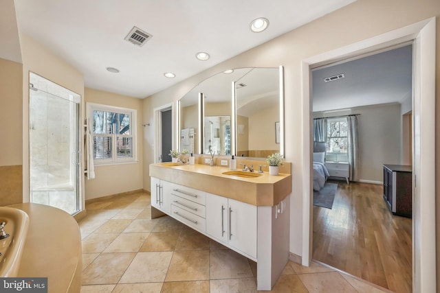 full bath featuring vanity, recessed lighting, visible vents, and connected bathroom