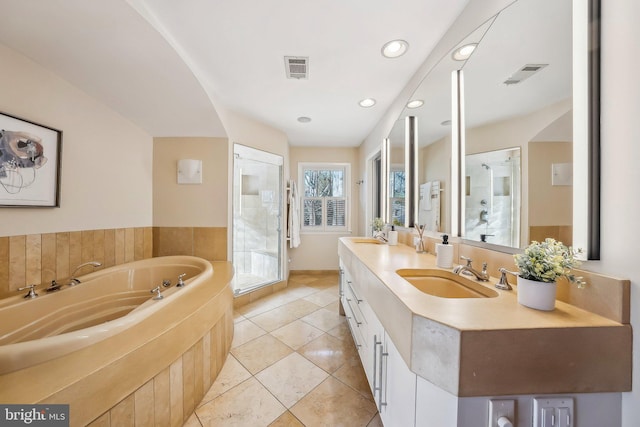 full bathroom with visible vents, a stall shower, vanity, and a bath