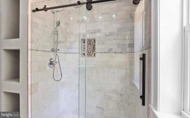 full bath featuring a shower stall