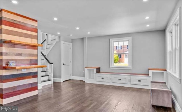 interior space with baseboards, dark wood-type flooring, and recessed lighting