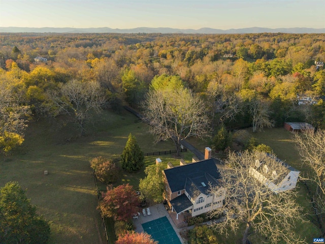 drone / aerial view featuring a mountain view and a forest view