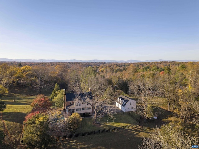 bird's eye view with a mountain view and a forest view