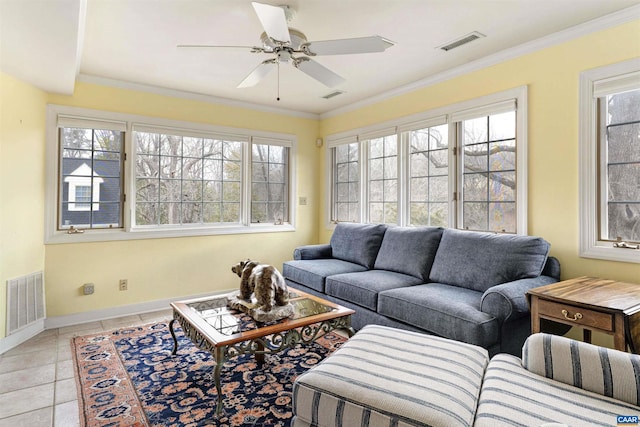 living area featuring ornamental molding and visible vents