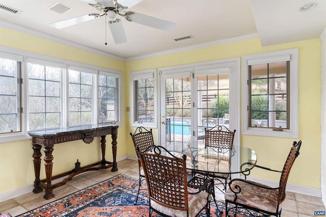 sunroom with visible vents and a ceiling fan